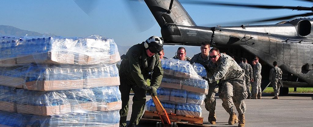 US helicopter, personnel with relief supplies