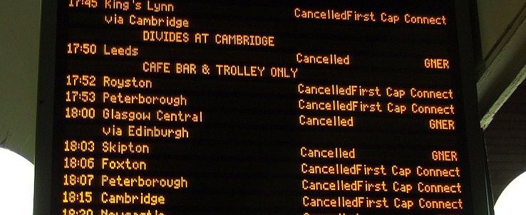 Train station info board showing cancelled trains