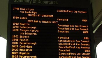 Train station info board showing cancelled trains