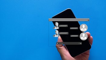 Smartphone displaying chatbot conversation with robotic avatar on blue background