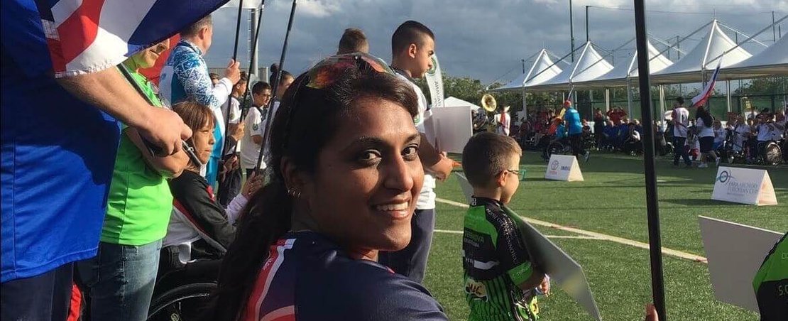 Tania Nadarajah in Paralympic kit holding Union Jack flag