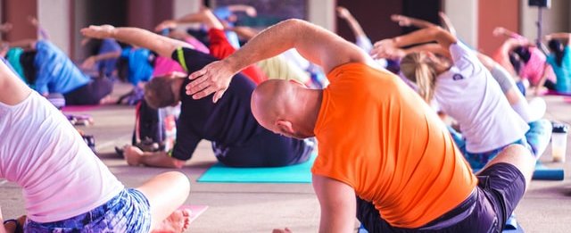 Group stretching in yoga class