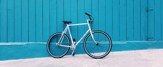Bicycle against blue wall