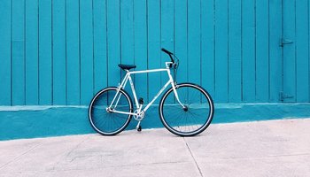 Bicycle against blue wall