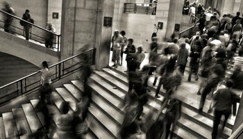 People on stairs in gallery