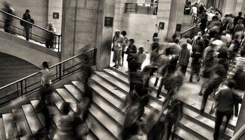 People walking up stairs, blurred, black & white photo