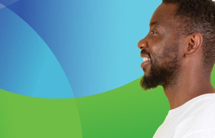 The side view of a man against a green and blue background